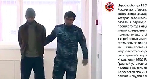 Алаудин Хангошвили под конвоем. Скриншот сообщения канала "ЧП Чечня" https://www.instagram.com/p/B7vTw7gFge2/
