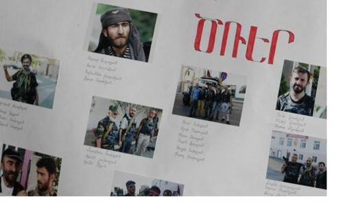 Фрагмент плаката с фотографиями членов "Сасна Црер". Фото Армине Мартиросян для "Кавказского узла".